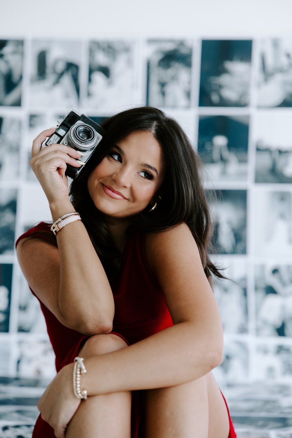 Lily in red with a vintage camera